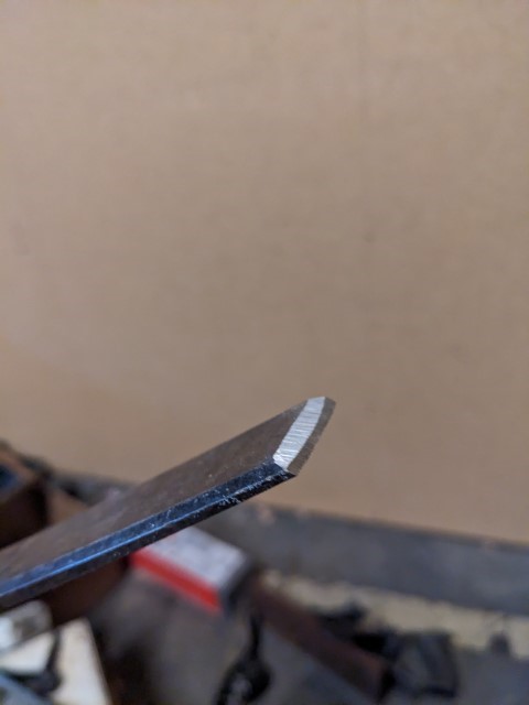 A chisel that I have ground on the bench grinder so the bevel is almost 90 degrees.