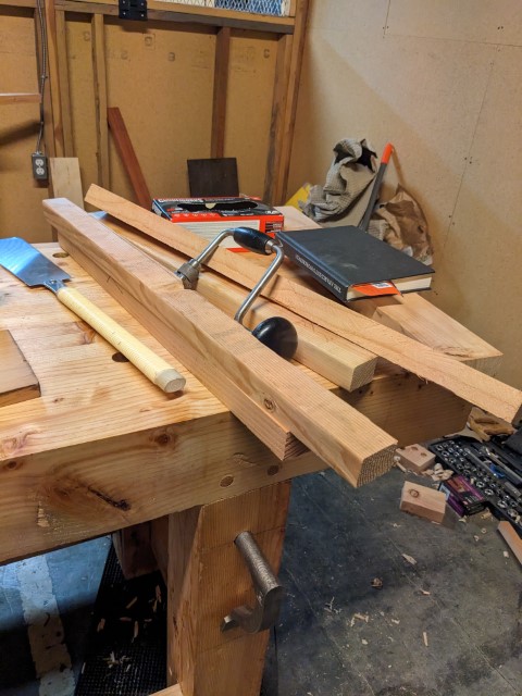 Four rough cut sticks that will become the legs for the sawbench.
